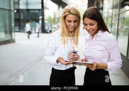 Picture of two young beautiful women as business partners Stock Photo