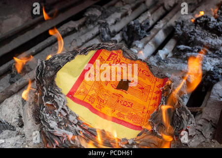 Joss paper burning in a chinese temple Stock Photo