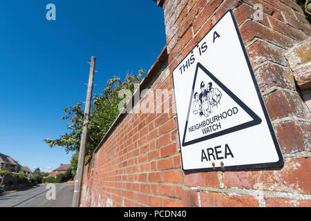 Neighbourhood watch sign on a wall at the end of a road in Littlehampton, West Sussex, England, UK. Stock Photo