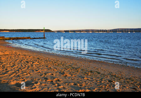 Poole Harbour, with Brownsea Island on the left and the Purbeck hills in the distance Stock Photo