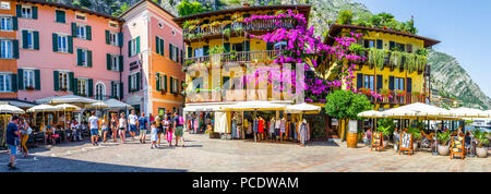 Purple hanging flowers from balconies in Limone Sul Garda, Italy Stock Photo