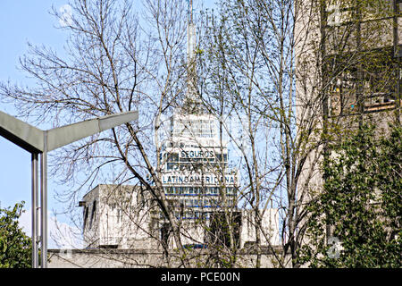 Latinoamericana Tower seen throw some buildings and trees in Reforma Street. Stock Photo