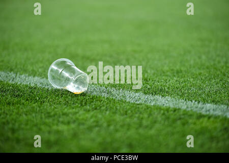 Plastic trash can on the turf on a soccer field Stock Photo