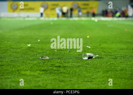 Plastic trash can on the turf on a soccer field Stock Photo