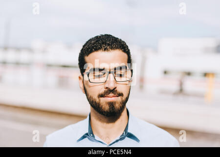 Portrait of thoughtful syrian man with his eyes closed Stock Photo