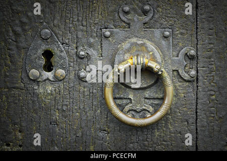 old metalic latch on wooden door, ancient wood texture Stock Photo
