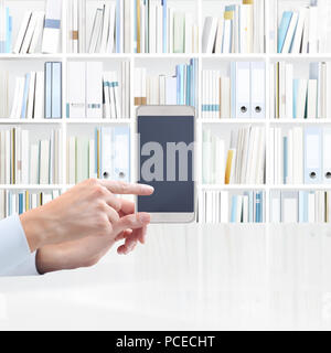 hand with smart phone, finger pointing screen, isolated on library background, web banner and copy space template Stock Photo