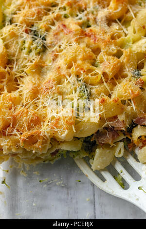 Pasta and broccoli casserole with white spatula in it Stock Photo
