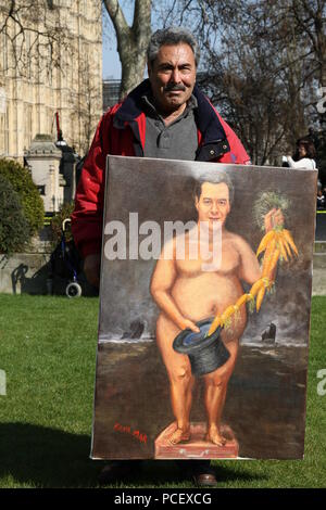 Kaya Mar displaying one of his political paintings in the City of Westminster, London, UK. Kaya Mar is a well known artist and has a painting in the London Museum. George Osborne depicted on painting. Stock Photo