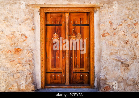 Traditional Omani style wooden door that is popular in middle east Stock Photo