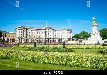 LONDON - MAY 14, 2018: View across flower beds in front of Buckingham Palace. Stock Photo