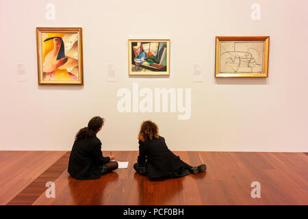 Students studying art works at the Ian Potter Centre, part of the ...