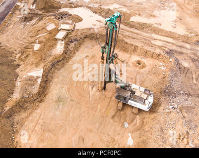 hydraulic machine for drilling wells and installing piles at construction site Stock Photo