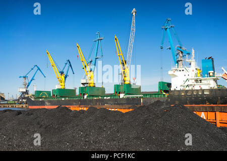Loading and unloading of coal cranes in the port of the Baltic Sea. Latvia Stock Photo