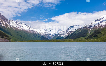 Snow capped mountains around Portage Lake which  is a glacial lake in the Chugach National Forest on the Kenai Peninsula of Alaska Stock Photo