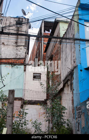 Vertical photo of colourful worn houses of a favela in Brazil. Stock Photo