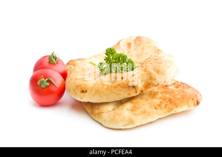 Indian naan bread and tomatoes isolated on white background. Stock Photo