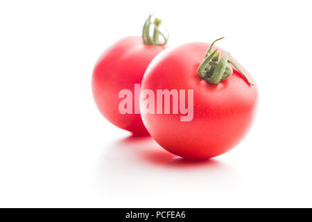 Tasty red tomatoes isolated on white background. Stock Photo