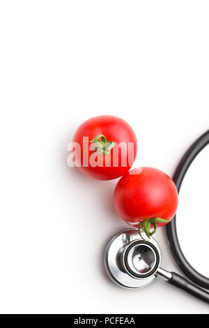 Red tomatoes and stethoscope isolated on white background. Stock Photo