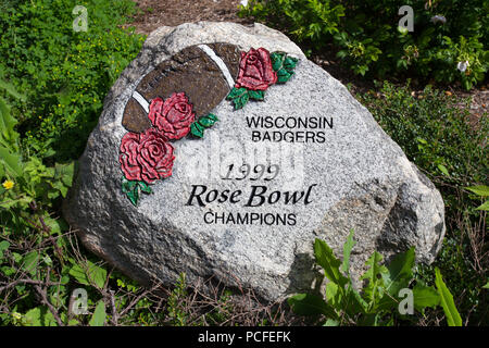 MADISON, WI/USA - JUNE 26, 2014:  Painted rock at Camp Randall noting Wisconsin Badger's 1999 Rose Bowl Victory. Stock Photo