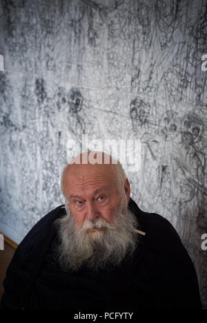 01 August 2018, Austria, Prinzendorf an der Zaya: The Austrian painter and action artist Hermann Nitsch sits in front of one of his works at Prinzendorf Castle. He will turn 80 on 29 August 2018. Photo: David Visnjic/dpa Stock Photo