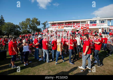 Aberdeen fans drink at the cricket ground next to the stadium before the UEFA Europa League Second Qualifying Round second leg match between Burnley and Aberdeen at Turf Moor on August 2nd 2018 in Burnley, England. (Photo by Daniel Chesterton/phcimages.com) Stock Photo