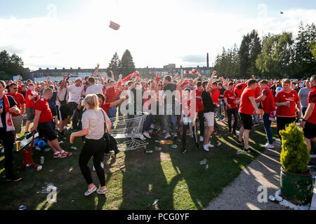 Aberdeen fans drink at the cricket ground next to the stadium before the UEFA Europa League Second Qualifying Round second leg match between Burnley and Aberdeen at Turf Moor on August 2nd 2018 in Burnley, England. (Photo by Daniel Chesterton/phcimages.com) Stock Photo