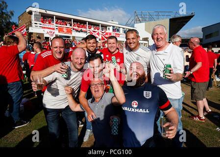 Aberdeen fans drink at the cricket ground next to the stadium before the UEFA Europa League Second Qualifying Round second leg match between Burnley and Aberdeen at Turf Moor on August 2nd 2018 in Burnley, England. (Photo by Daniel Chesterton/phcimages.com) Stock Photo