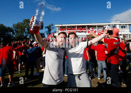 Aberdeen fans drink at the cricket ground next to the stadium before the UEFA Europa League Second Qualifying Round second leg match between Burnley and Aberdeen at Turf Moor on August 2nd 2018 in Burnley, England. (Photo by Daniel Chesterton/phcimages.com) Stock Photo