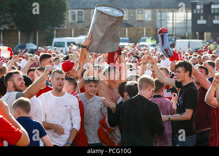 Aberdeen fans drink at the cricket ground next to the stadium before the UEFA Europa League Second Qualifying Round second leg match between Burnley and Aberdeen at Turf Moor on August 2nd 2018 in Burnley, England. (Photo by Daniel Chesterton/phcimages.com) Stock Photo