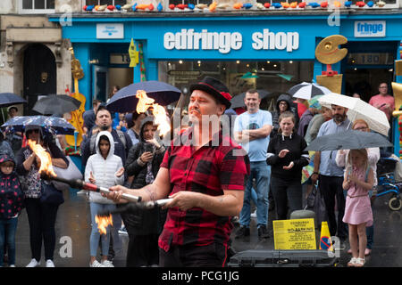 Edinburgh, Scotland, UK; 2 August, 2018. On day before official opening of the Edinburgh Festival Fringe 2018, performers are active on the Royal Mile including this fire eater. Credit: Iain Masterton/Alamy Live News Stock Photo