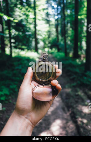 Man with compass in hand Stock Photo