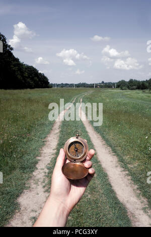 Man with compass in hand Stock Photo