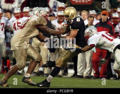 Francisco, Calif. (Dec. 29, 2004) U.S. Naval Academy Midshipman 1st Class Aaron Polanco catches a pass from slot back Frank Divis in the 4th quarter of play against the Lobos of New Mexico at the Emerald Bowl in San Francisco.  Polanco passed for 102 yards and a touchdown and rushed for 133 yards and three more scores for the Midshipmen (10-2)  The Senior quarterback was 3-of-6 passing with 26 rushes, also caught two passes for 23 yards. Navy triumphed over New Mexico 34-19 for their first bowl win since 1996 and first 10 game winning record in 99 years. U.S. Navy Stock Photo