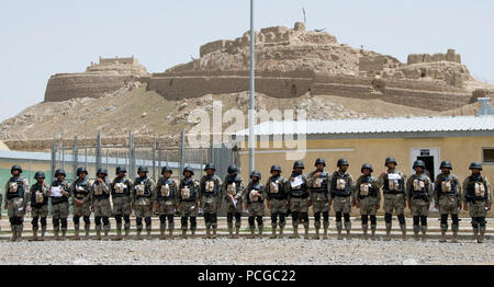 SPIN BULDAK, Afghanistan--Afghan Border Police (ABP) Officers gather in formation after receiving their certificates of completion for the Focused Border Development Training Program during a ceremony held outside the ABP Border Center at Spin Buldak on April 2, 2009. Two-hundred new Border Police Officers graduated from the seven-week training program. This is the first group from the 3rd Zone to receive the training which taught fundamentals in entry-control points, road blocks, and other areas such as vehicle maintenance and infantry patrol. ISAF Stock Photo