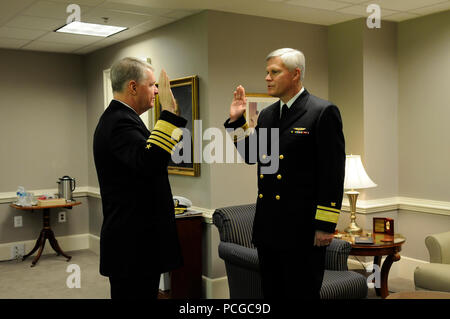 Chief of Naval Operations Adm. Gary Roughead promotes Rear Adm. Alan Thompson to vice admiral during a ceremony at the Pentagon. Stock Photo
