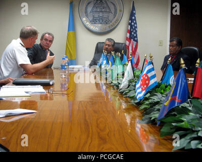 NGERULMUD, Palau (June 30, 2011) Adm. Patrick Walsh, commander of U.S. Pacific Fleet, left, addresses President Johnson Toribiong of Palau during a meeting with Assistant Secretary for East Asian and Pacific Affairs Kurt Campbell, left center, and a delegation he is leading. The delegation also includes Adm. Patrick Walsh, commander of U.S. Pacific Fleet, Iffice of the Secretary of Defense South/Southeast Asia Principal Director, Marine Corps Brig. Gen. Richard Simcock, and U.S. Agency for International Development (USAID) Assistant Administrator Nisha Biswal, who are visiting nations througho Stock Photo