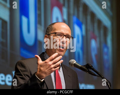 01 November 2013 - Washington, DC - Secretary of Labor Thomas Perez give remarks at the U.S. Chamber of Commerce Labor Relations Committee meeting.  Secretary Perez was greeted by Chamber of Commerce Senior Vice President Randy Johnson.  Scott Mugno, Chairman of the Labor Relations Committee moderated the Q&A part of the program. Stock Photo