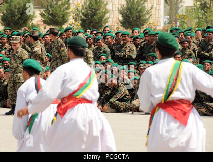 Kabul, Afghanistan Afghan National Army recruits perform a traditional dance at Kabul Military Training Center (KMTC) during a graduation ceremony. The basic training course at KMTC is eight weeks in length and provides soldiers with the skills necessary to advance to the next level of training and proceed closer to deployment. U.S. Navy Stock Photo