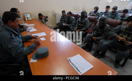 KABUL, Afghanistan (April 18, 2010) – Afgahn Col. Khuda yar Toutakhil, Finance Officer, 4th Brigade Afghan National Civil Order Police (ANCOP), far left, briefs members of the elite force on pay and benefits at a Kabul facility.  The police officers registered and received briefings and training as they prepare for operations in Afghanistan. (US Navy Stock Photo