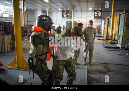 LUANDA, Angola (March 6, 2015) An Angolan marine escorts Lance Cpl. Micah Salmon during a training exercise aboard the Military Sealift Command joint high-speed vessel USNS Spearhead (JHSV 1) during Africa Partnership Station. Spearhead is on a scheduled deployment to the U.S. 6th Fleet area of responsibility to support the international collaborative capacity-building program Africa Partnership Station. Stock Photo