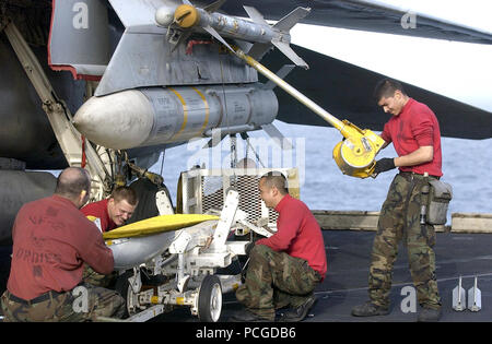 Gulf (Mar. 20, 2003) Р Aviation Ordnanceman install an AIM-54C Phoenix long-range air-to-air missile under the wing of a F-14D Tomcat assigned to the ТBounty HuntersУ of Fighter Squadron Two (VF-2) onboard the aircraft carrier USS Constellation (CV-64). Constellation and Carrier Air Wing Two (CVW 2) are currently on a scheduled deployment in support of Operation Iraqi Freedom. U.S. Navy Stock Photo
