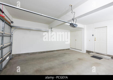 Clean empty two car garage interior in a modern suburban home. Stock Photo