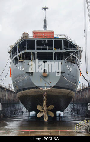 Ore. (May 2, 2017) The submarine tender USS Frank Cable (AS 40) rests as its dry-dock drains in Portland, Ore. Frank Cable is in Portland, Ore. for a scheduled dry-dock phase maintenance availability. Stock Photo