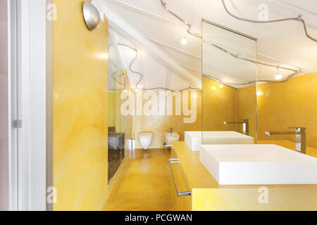 interior new loft, yellow bathroom, two sinks Stock Photo