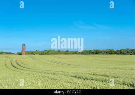 Landscape with cornfield at Cape Arkona and former Marinepeilturm tower in the background, Putgarten, Rügen, Mecklenburg-Vorpommern, Germany, Europe Stock Photo