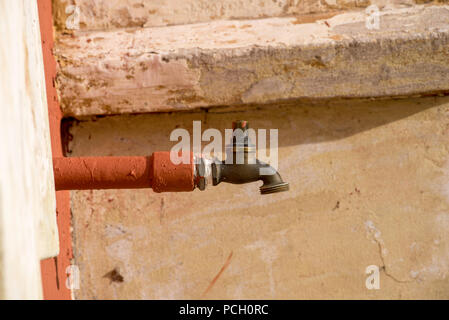 An old brass tap attached to an outside wall of the historic Bathurst Railway Station in NSW, Australia Stock Photo