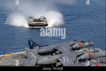 GULF OF ADEN (May 9, 2016) A landing craft, air cushion, assigned to Assault Craft Unit (ACU) 5, transits toward the well deck of amphibious assault ship USS Boxer (LHD 4). Boxer is the flagship for the Boxer Amphibious Ready Group and, with the embarked 13th Marine Expeditionary Unit, is deployed in support of maritime security operations and theater security cooperation efforts in the U.S. 5th Fleet area of operations. Stock Photo