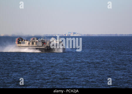 NORFOLK (Jan. 30, 2012) Landing Craft Air Cushion (LCAC) 87 from Assault Craft Unit (ACU) 4 prepares to embark aboard the amphibious assault ship USS Wasp (LHD 1) in support of exercise Bold Alligator 2012 (BA12). Bold Alligator 2012, the largest amphibious exercise in the past 10 years, represents the Navy and Marine Corps' revitalization of the full range of amphibious operations. The exercise focuses on today's fight with today's forces, while showcasing the advantages of seabasing. #BA12 Stock Photo