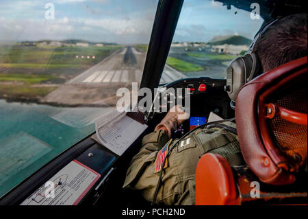 KANEOHE BAY, Hawaii (July 14, 2015) LT Christopher Malherek, assigned to the “Golden Eagles” of Patrol Squadron (VP) 9, prepares to land a P-3C Orion maritime patrol aircraft during a routine training flight for the squadron's advanced readiness program. VP-9 is involved in preparations for their inter-deployment readiness cycle, conducting exercises and maintenance to maximize operational performance and efficiency. Stock Photo